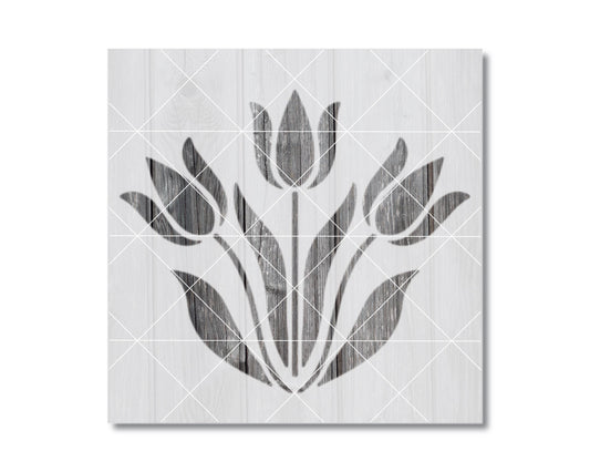 A black and white image depicting a stylized floral design with multiple tulips.