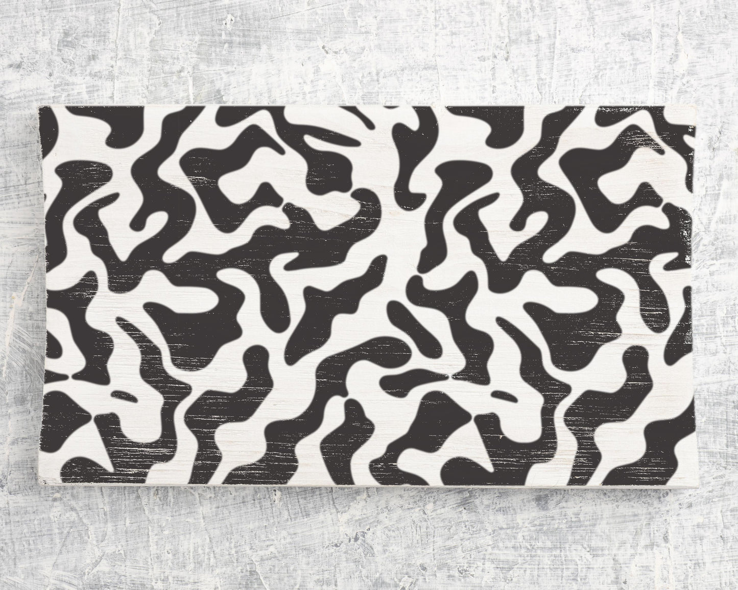 a striking black and white abstract pattern with swirling, organic shapes and lines.