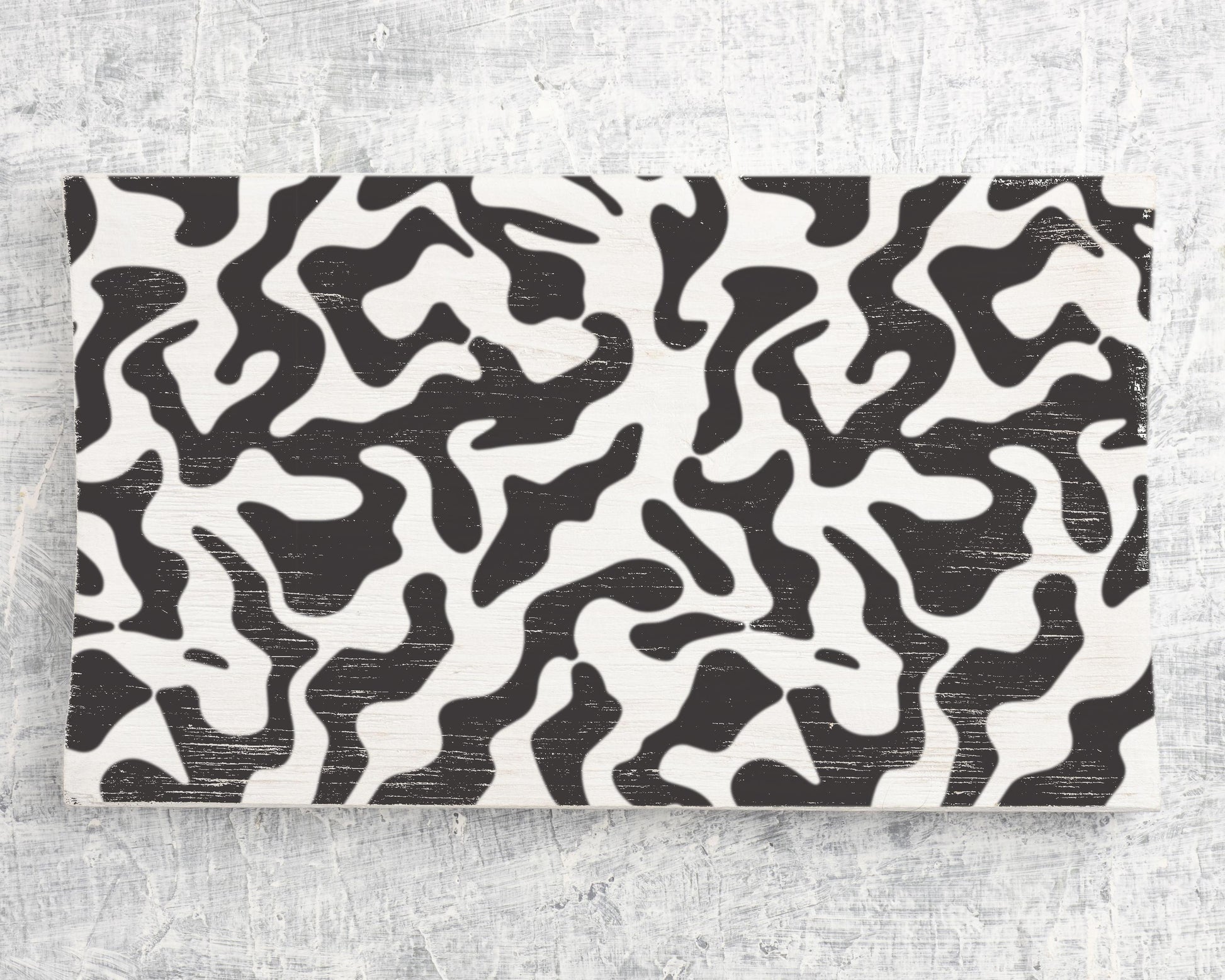 a striking black and white abstract pattern with swirling, organic shapes and lines.