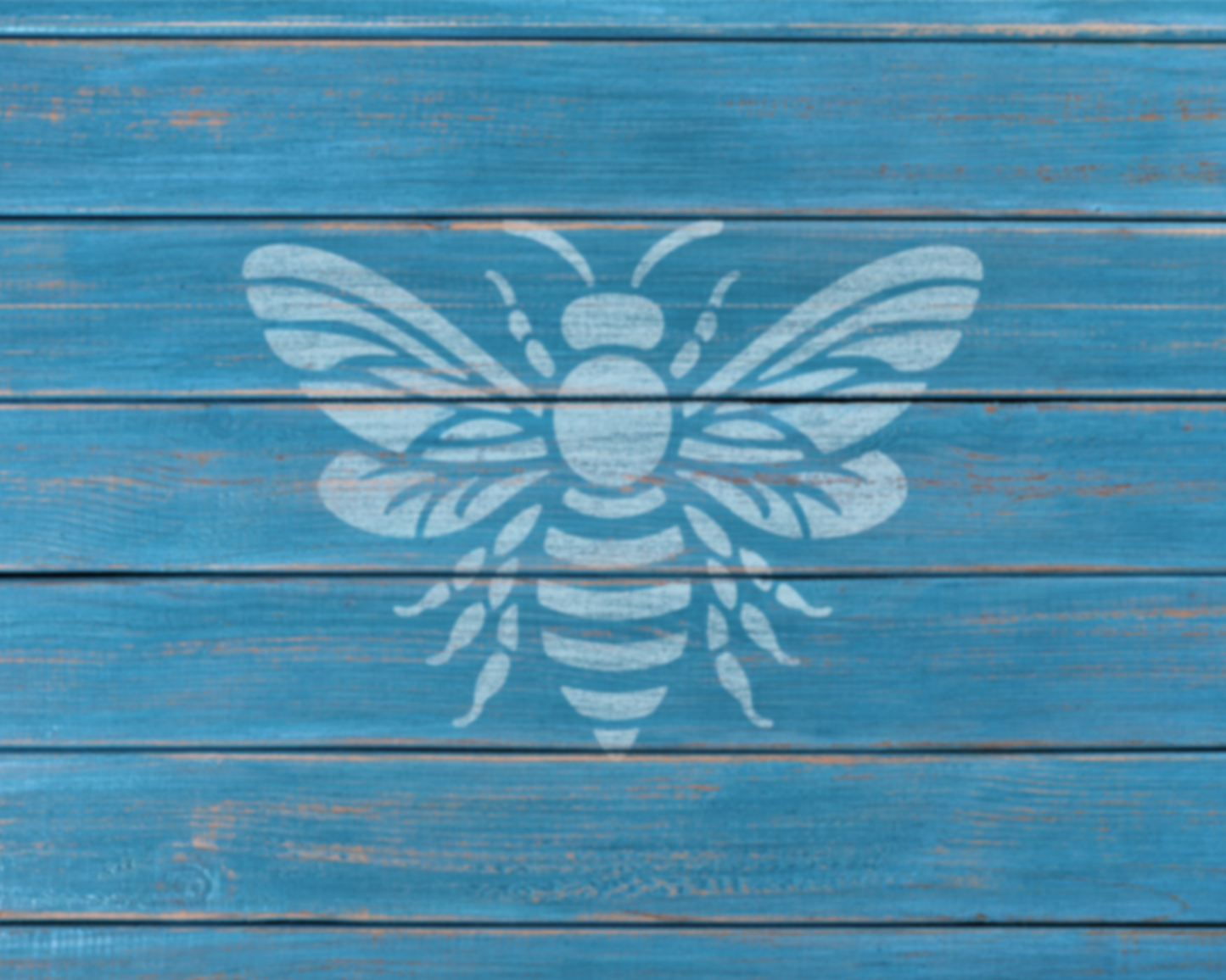 A white bee silhouette is painted on a blue wooden surface.