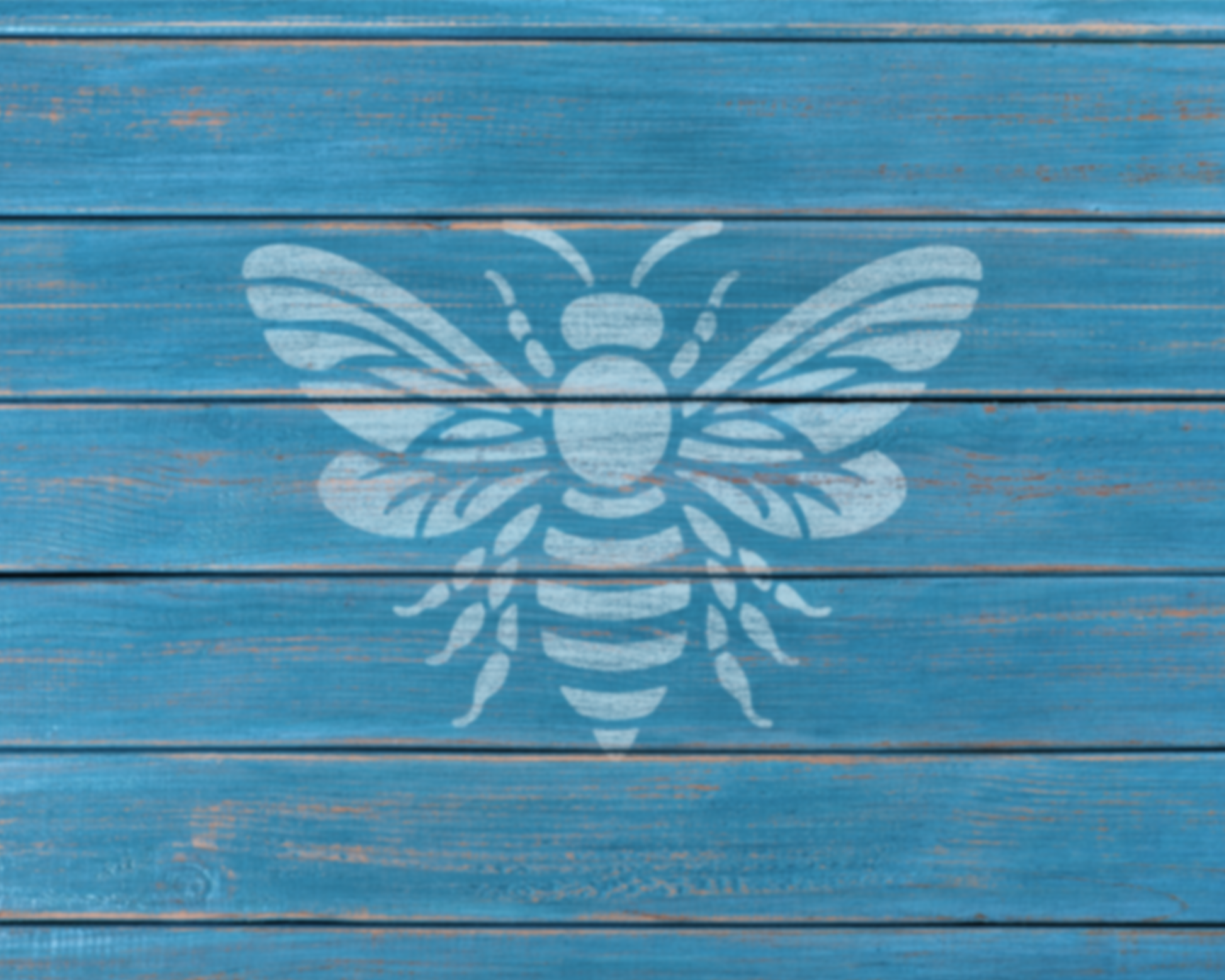 A white bee silhouette is painted on a blue wooden surface.