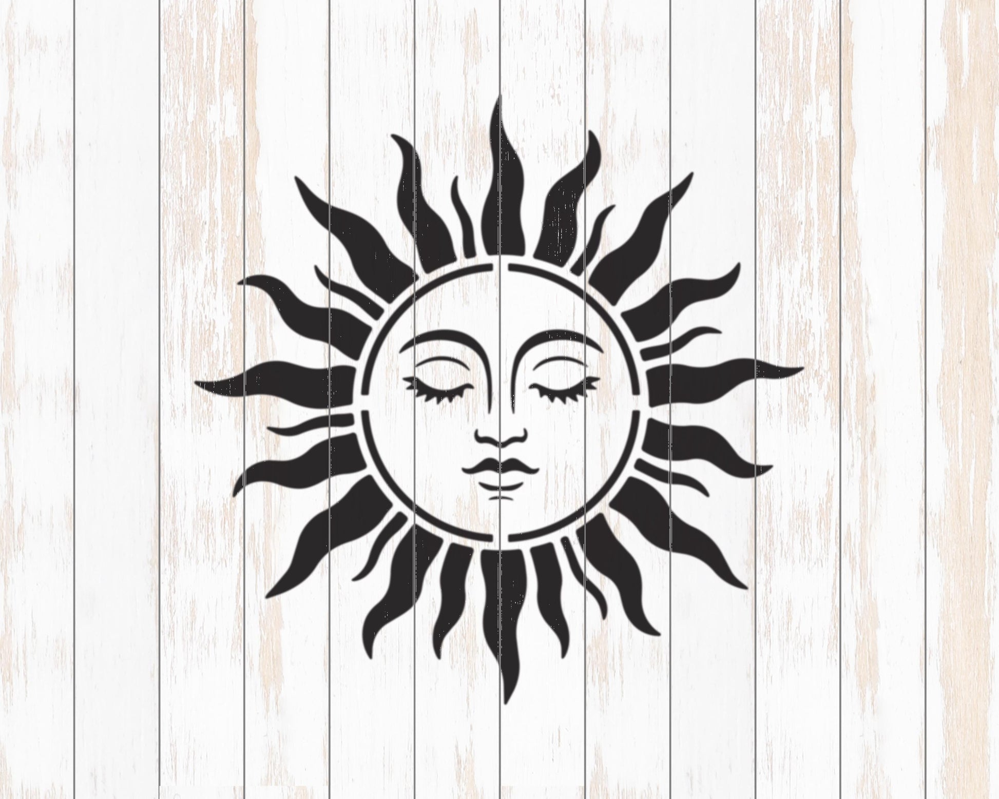 A black and white illustration of a sun with a face, set against a white wooden background.