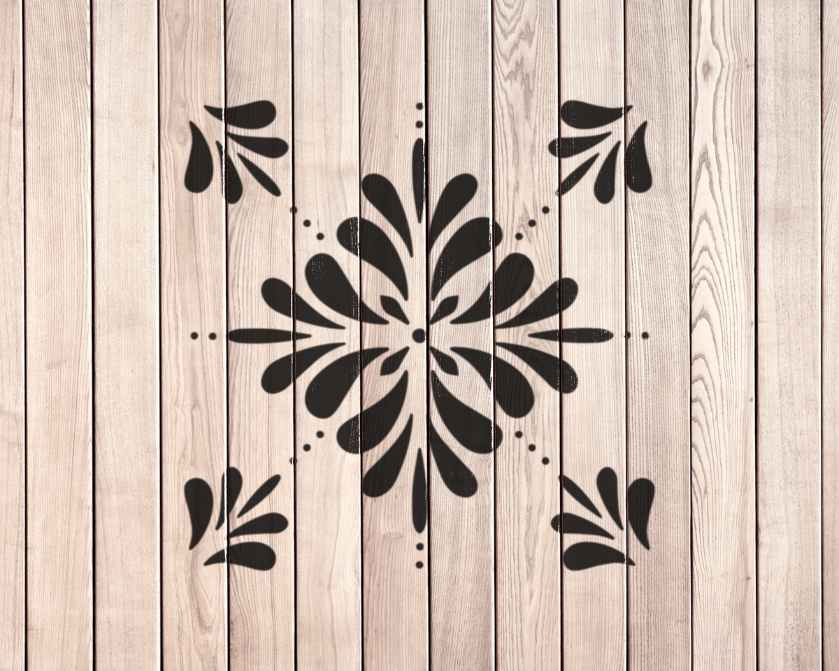 a wooden wall with a decorative black and white design in the center.
