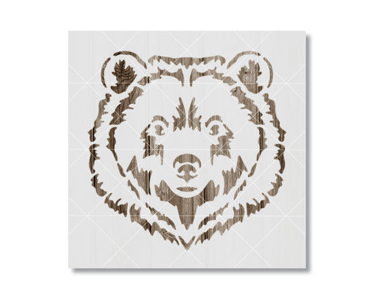 A stylized bear head stencil design on a white background.