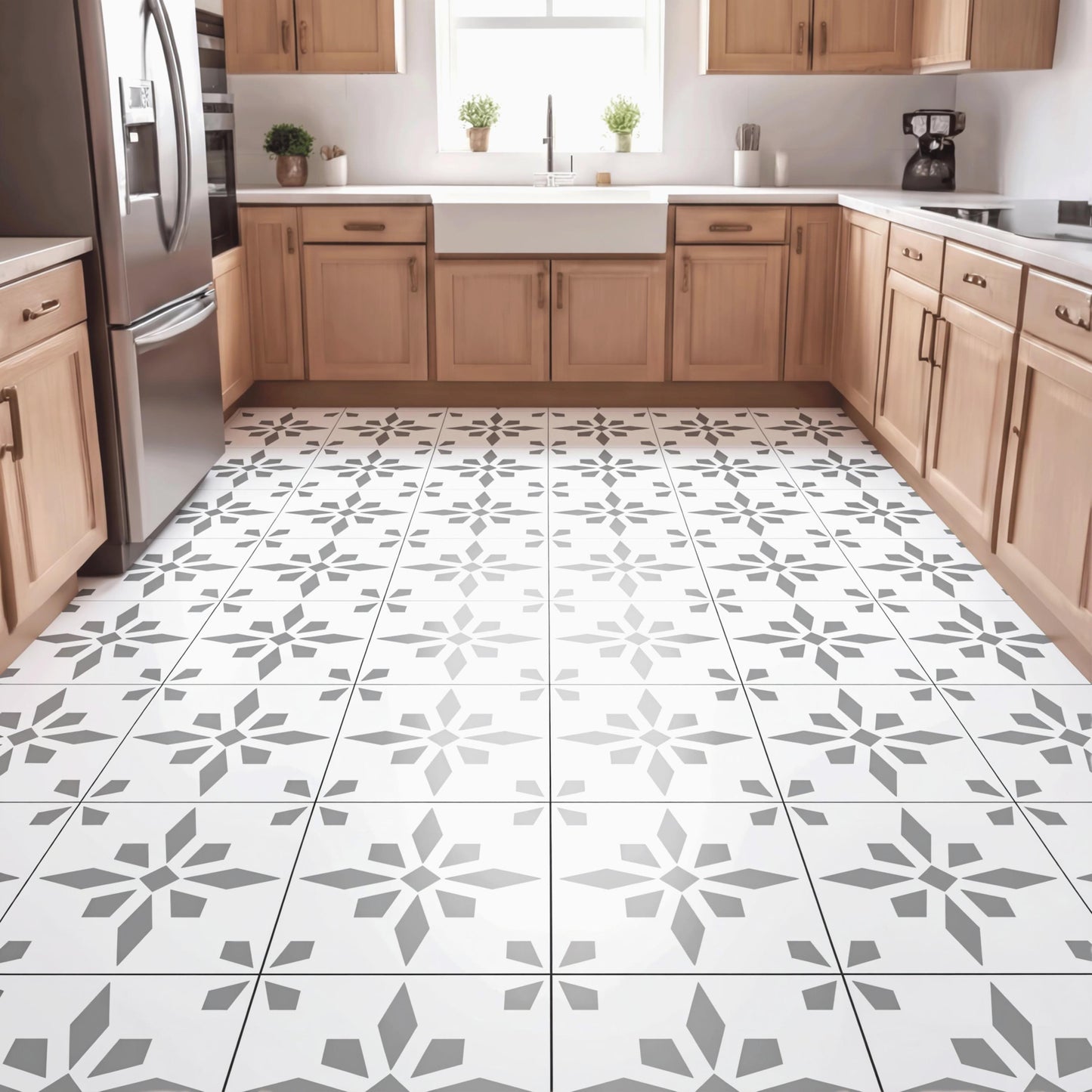 a modern kitchen with a large tile floor featuring a repeating pattern of gray and white geometric shapes. The kitchen is equipped with wooden cabinets and stainless steel appliances, including a refrigerator, oven, and sink.