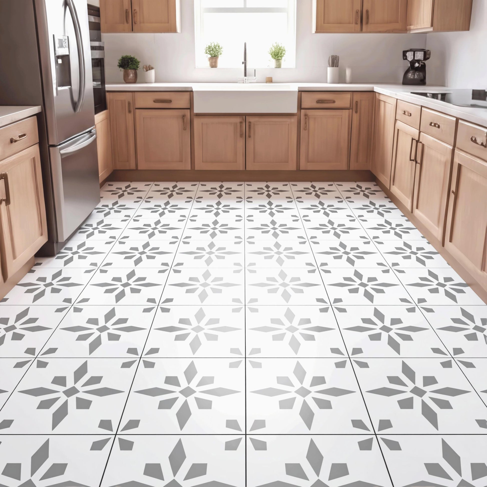 a modern kitchen with a large tile floor featuring a repeating pattern of gray and white geometric shapes. The kitchen is equipped with wooden cabinets and stainless steel appliances, including a refrigerator, oven, and sink.