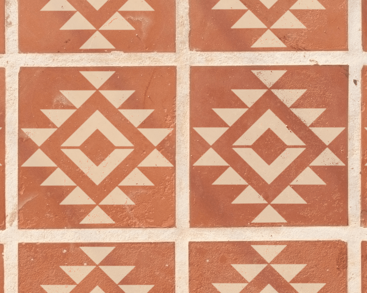 a repeating pattern of red and white geometric shapes, creating a visually striking and intricate design.