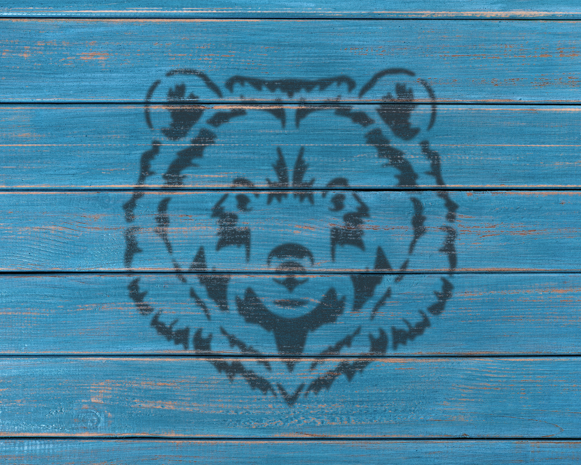 a blue wooden surface with a black bear silhouette in the center.