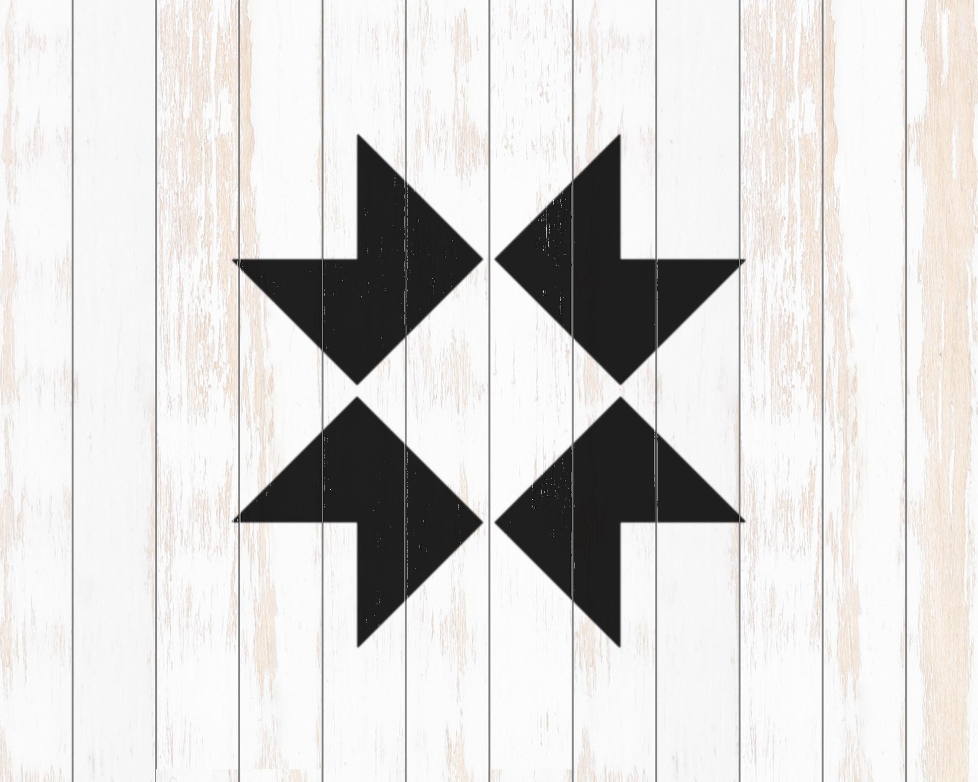 a simple, geometric design consisting of four black arrows pointing in different directions, set against a white wooden background.