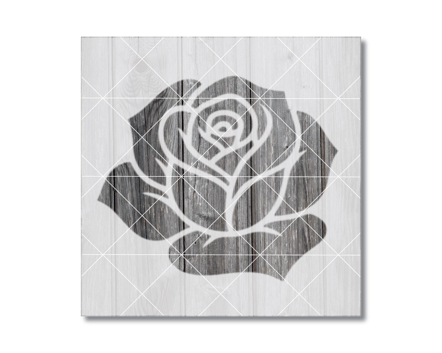 A black and white image of a rose on a wooden background.