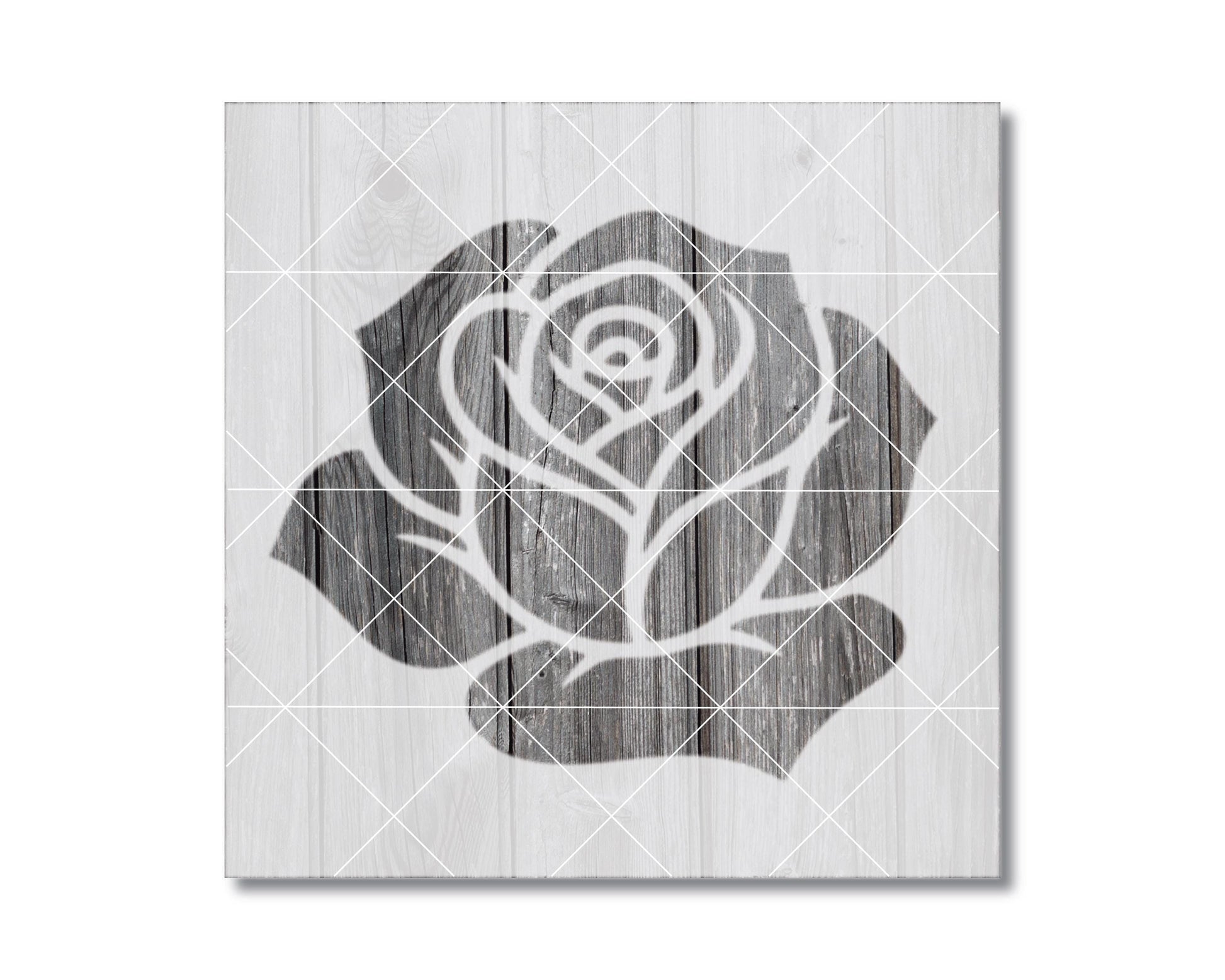 A black and white image of a rose on a wooden background.