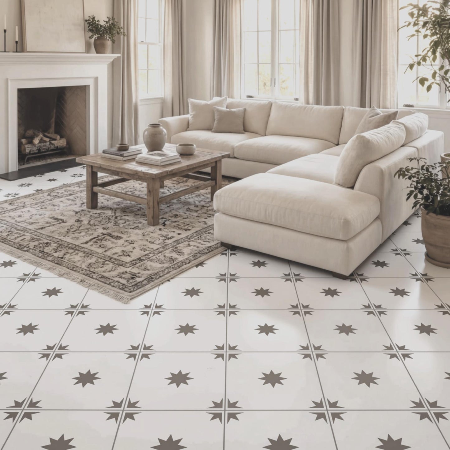 a cozy living room with a large sectional sofa, a wooden coffee table, and a fireplace. The room has a white tile floor with a star-shaped pattern, and there are several potted plants and vases adding to the decor.