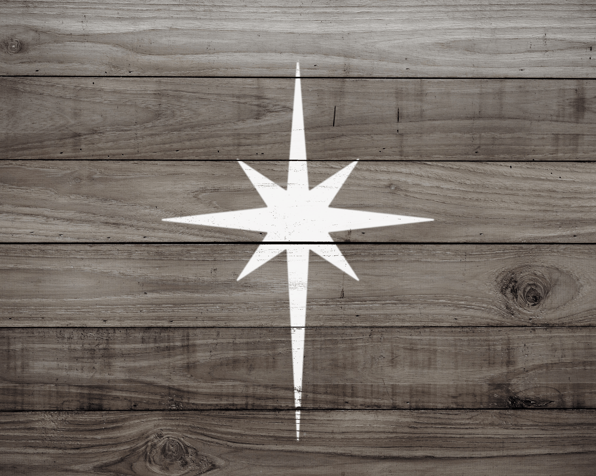 a wooden surface with a white star painted on it.