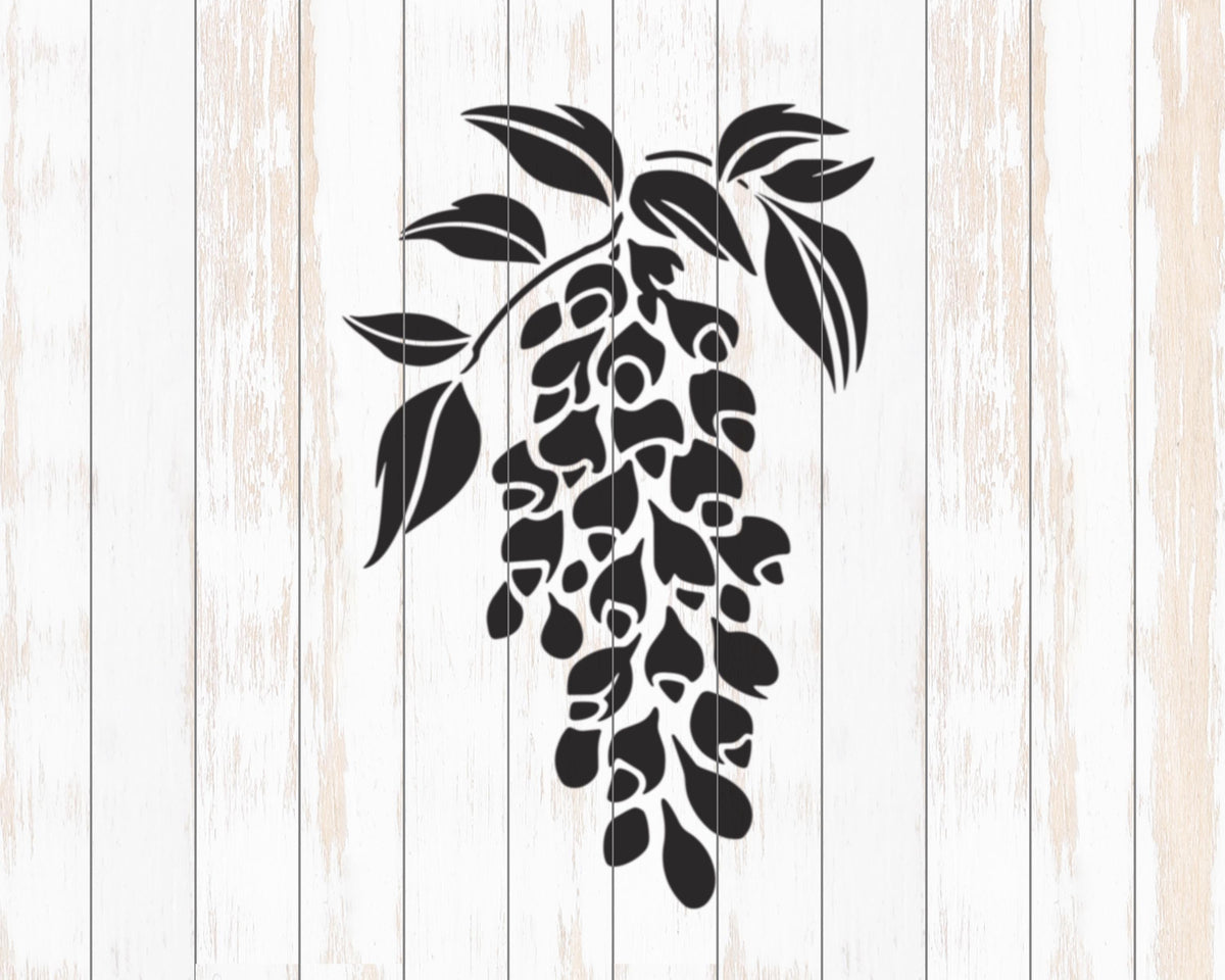 A black and white silhouette of a branch with leaves against a white wooden background.