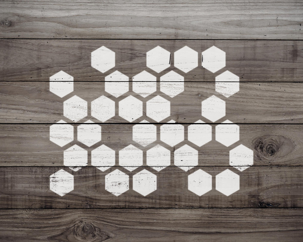 a wooden surface with a repeating pattern of white hexagonal shapes, creating a visually striking and geometric design.