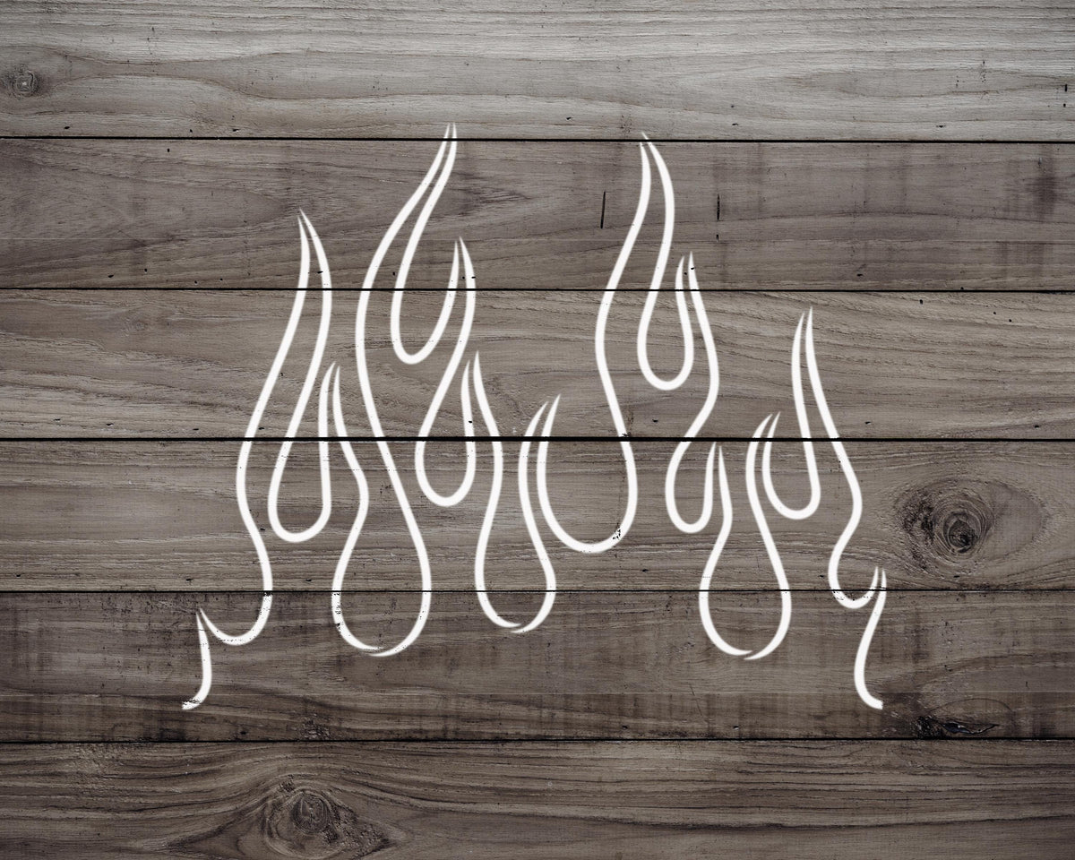 a wooden surface with a stylized design resembling flames or fire.
