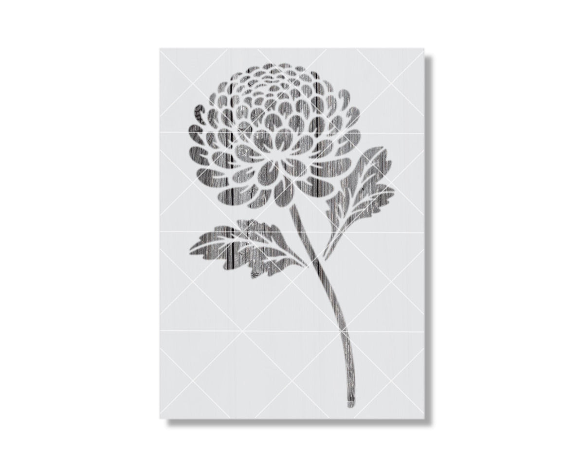 A black and white image depicting a stylized chrysanthemum flower.