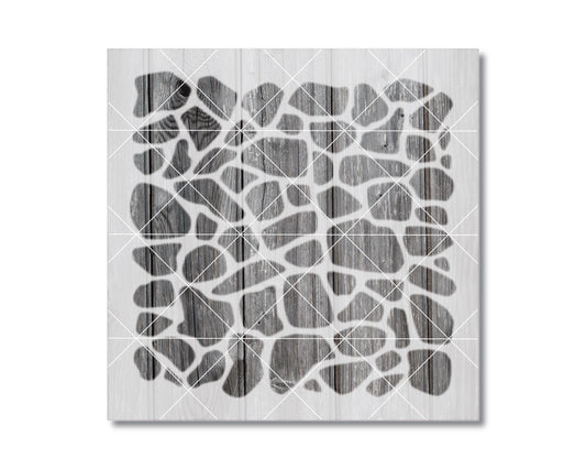 The image is a black and white photograph of a patterned surface, possibly a stone or wooden texture, with a grid-like arrangement of lines or shapes.