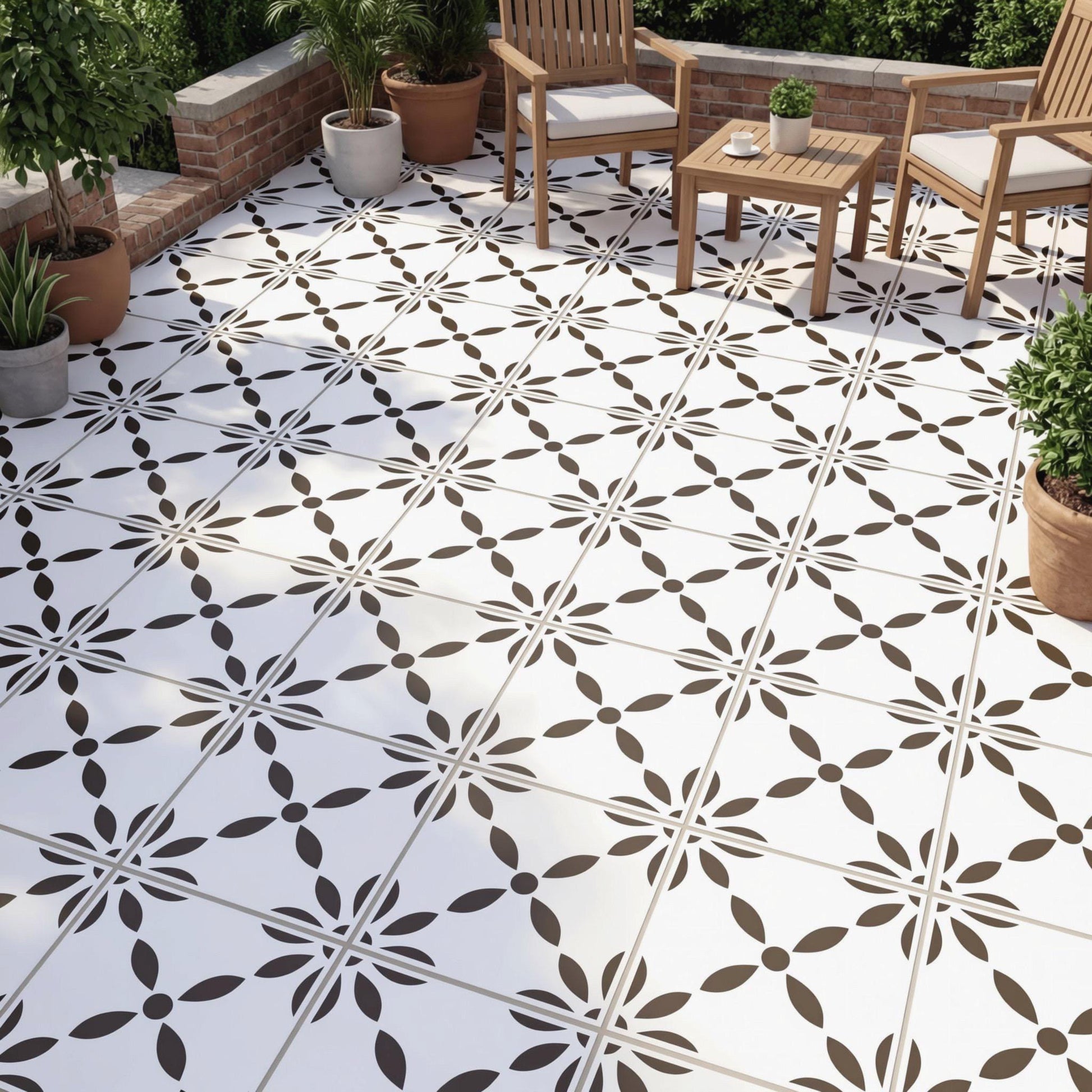a well-lit patio area with a white tile floor, wooden chairs, and potted plants. There is a square tile with a decorative pattern in the center of the floor.