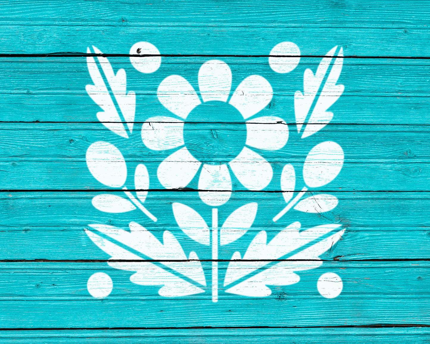 a blue wooden surface with a white floral design in the center.