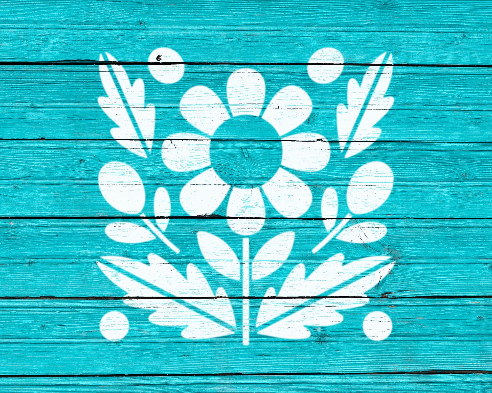 a blue wooden surface with a white floral design in the center.