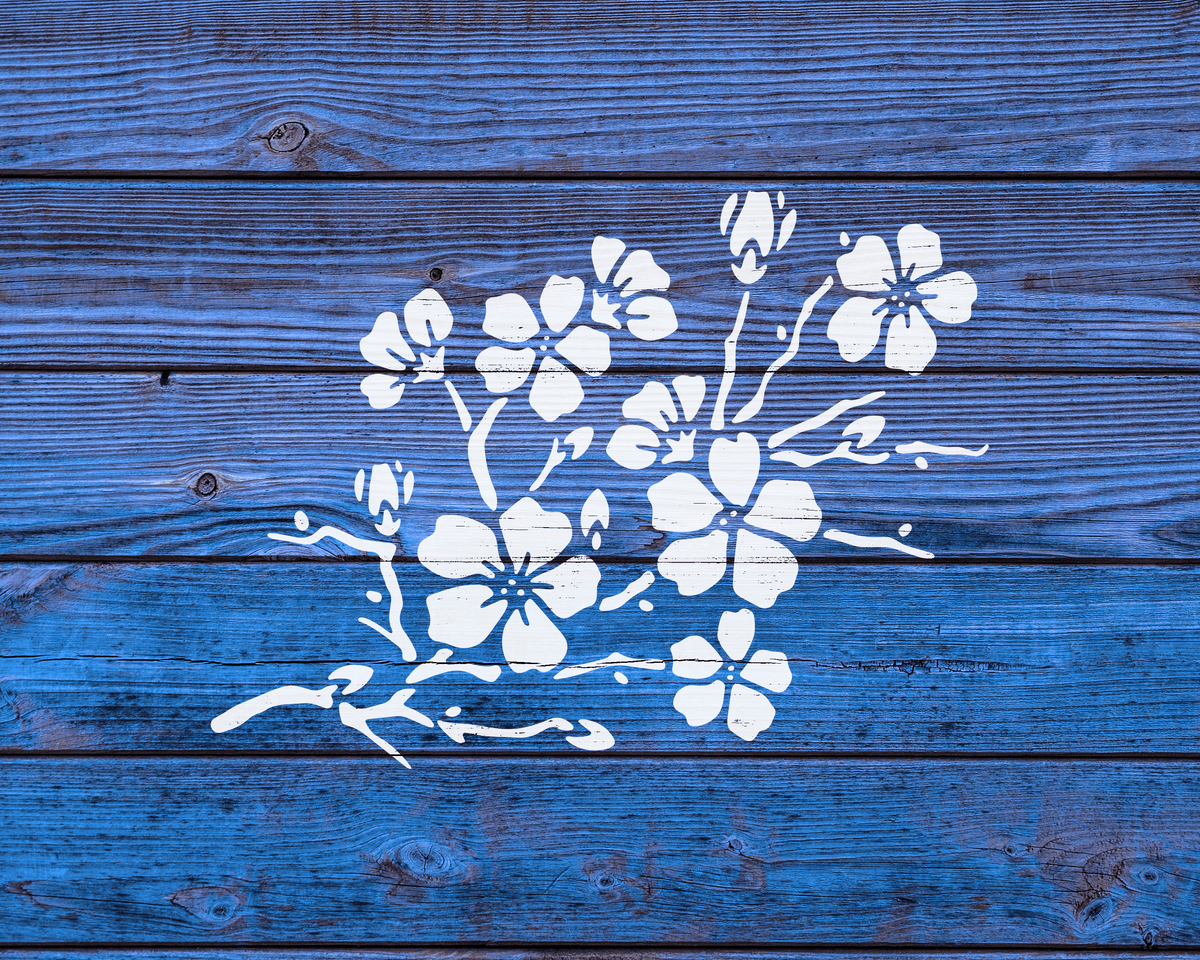 a blue wooden surface with a white floral design in the center.