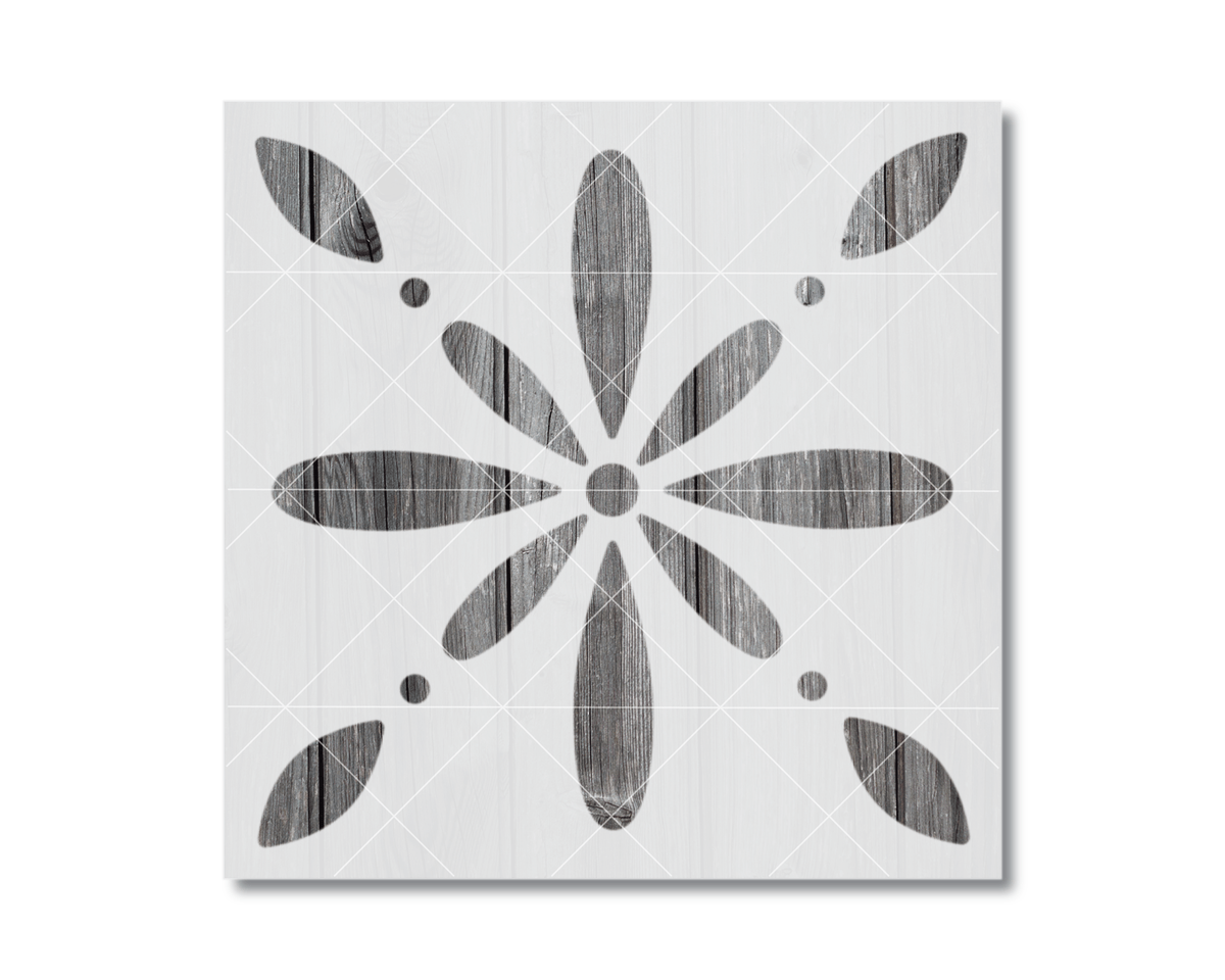 a square-shaped design with a central flower-like motif and eight smaller circular shapes surrounding it.