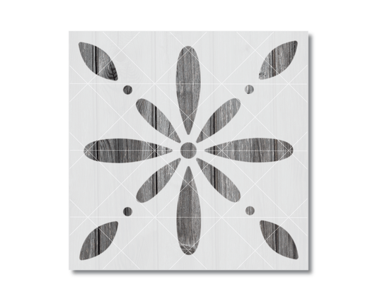 a square-shaped design with a central flower-like motif and eight smaller circular shapes surrounding it.