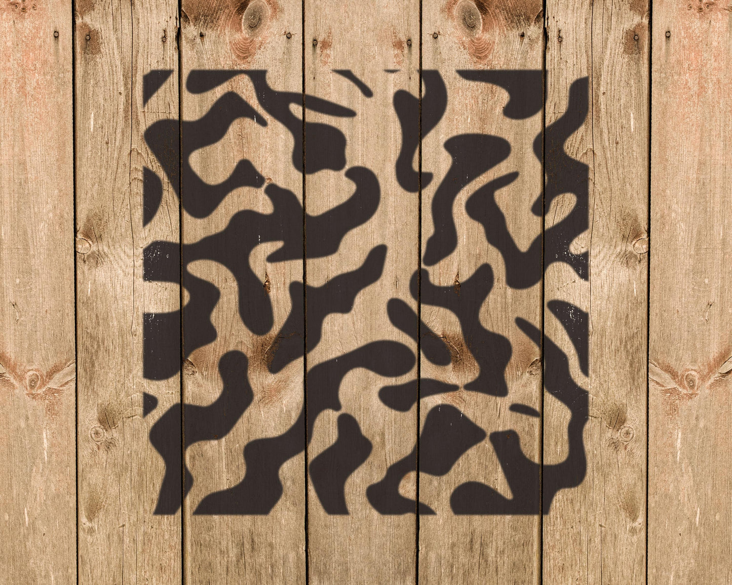 a wooden background with a black and white camouflage pattern.