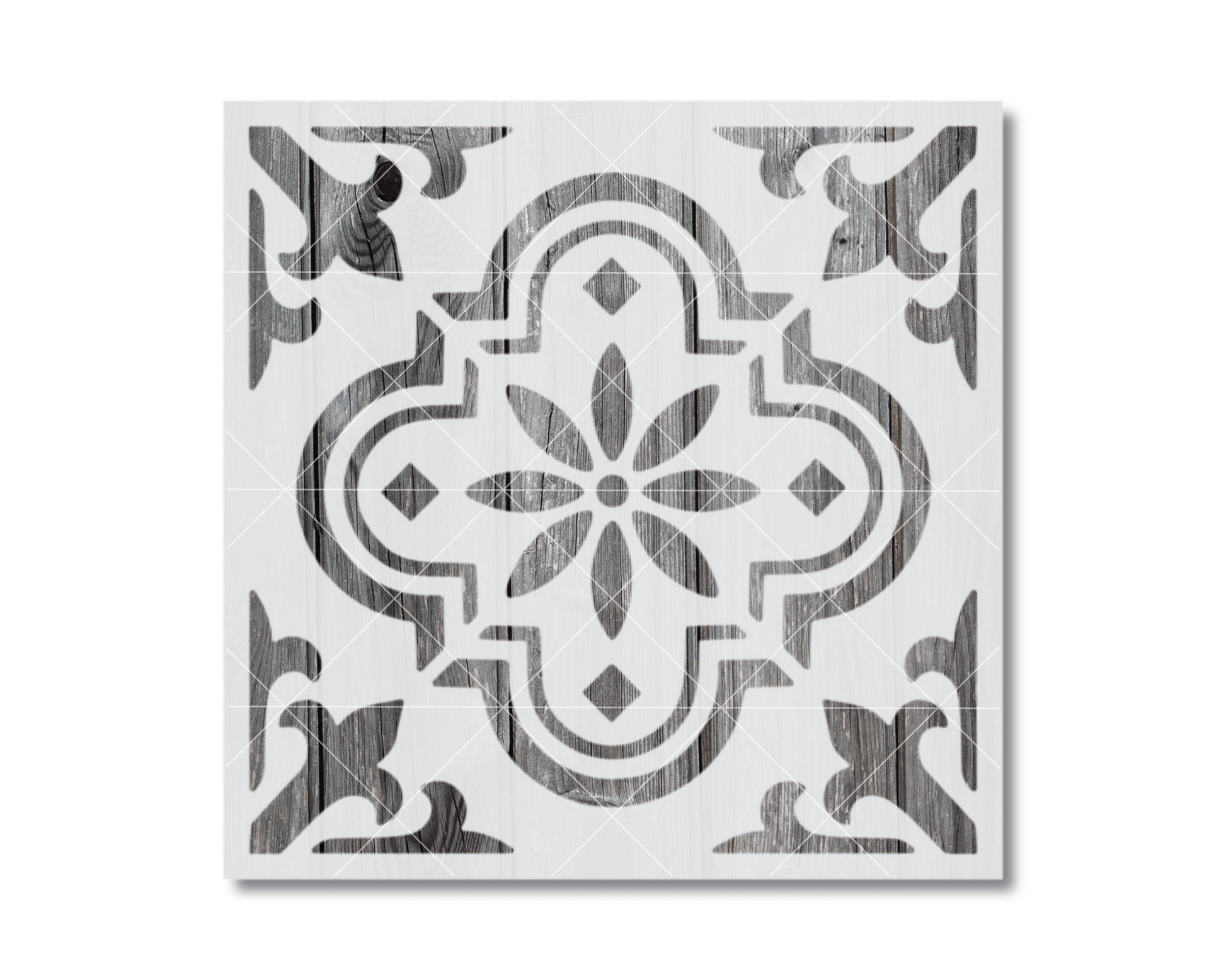 a square tile with a decorative pattern in black and white.