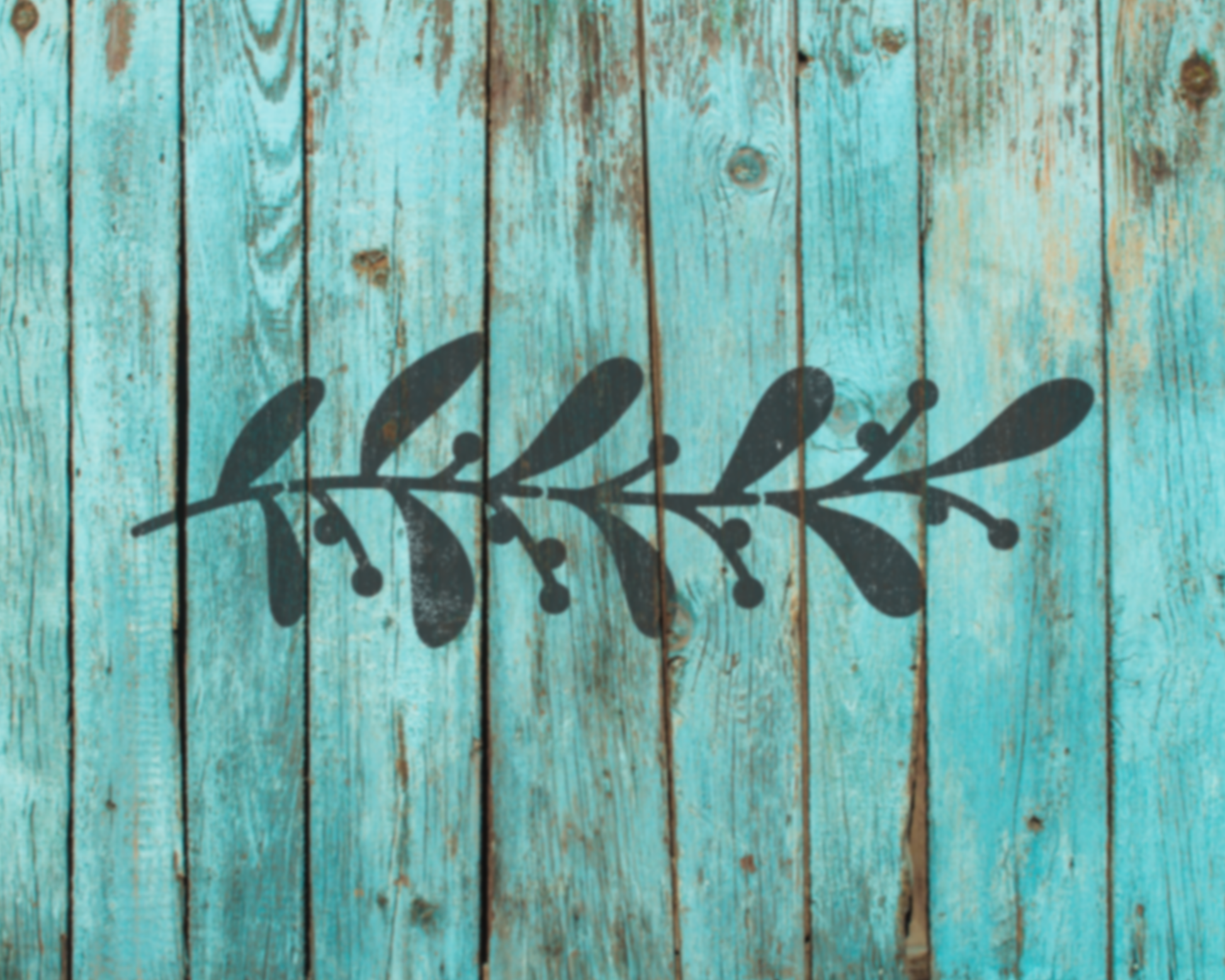 A black silhouette of a leaf or branch is superimposed on a weathered, blue wooden surface.