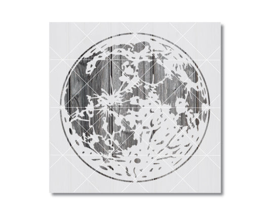a large, circular moon with a wooden texture, creating a striking contrast between the natural and man-made elements.
