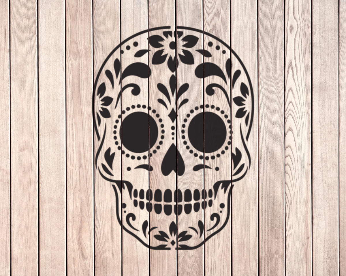 A black and white illustration of a skull with intricate floral designs on the top of the head.