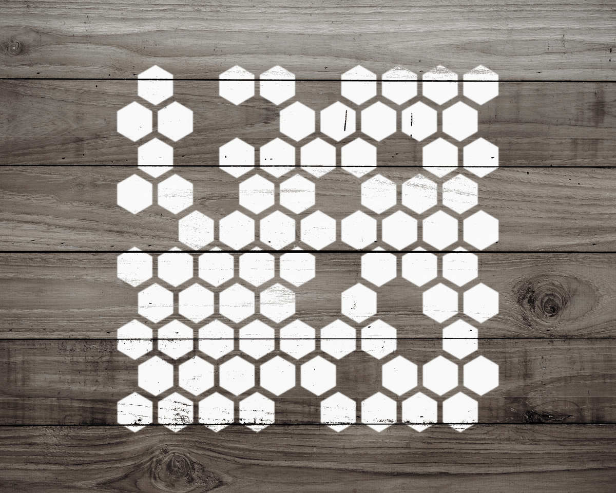 a wooden surface with a repeating pattern of white hexagonal shapes, creating a visually striking and geometric design.