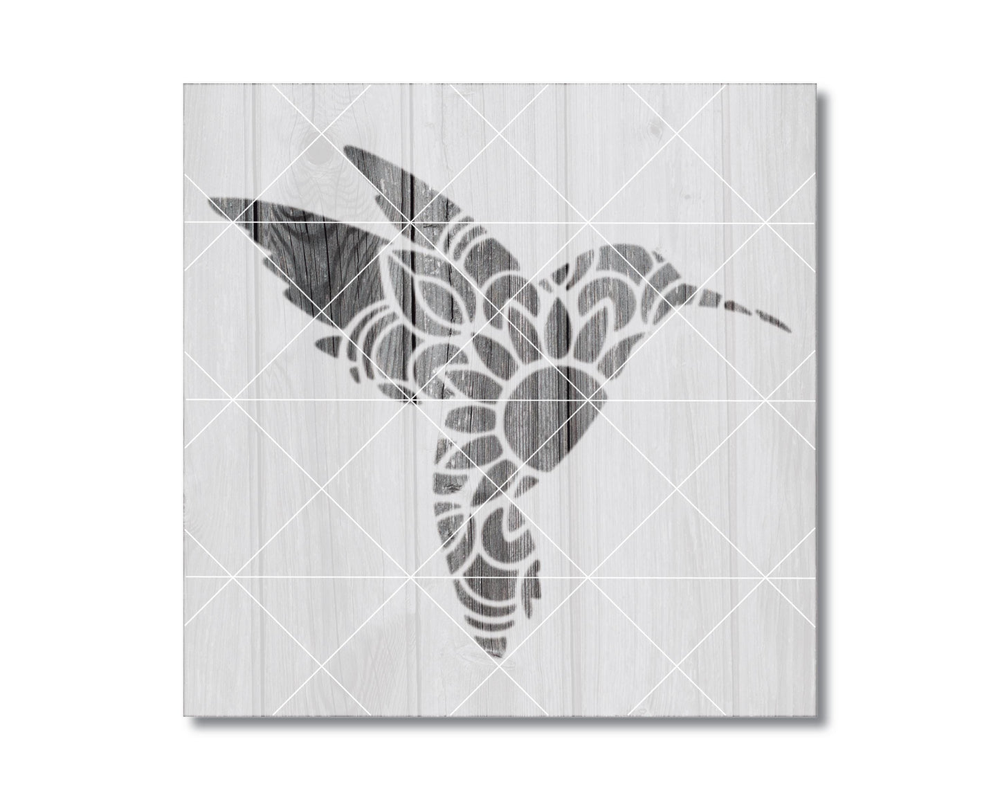 A black and white image depicting a stylized hummingbird silhouette against a wooden background.