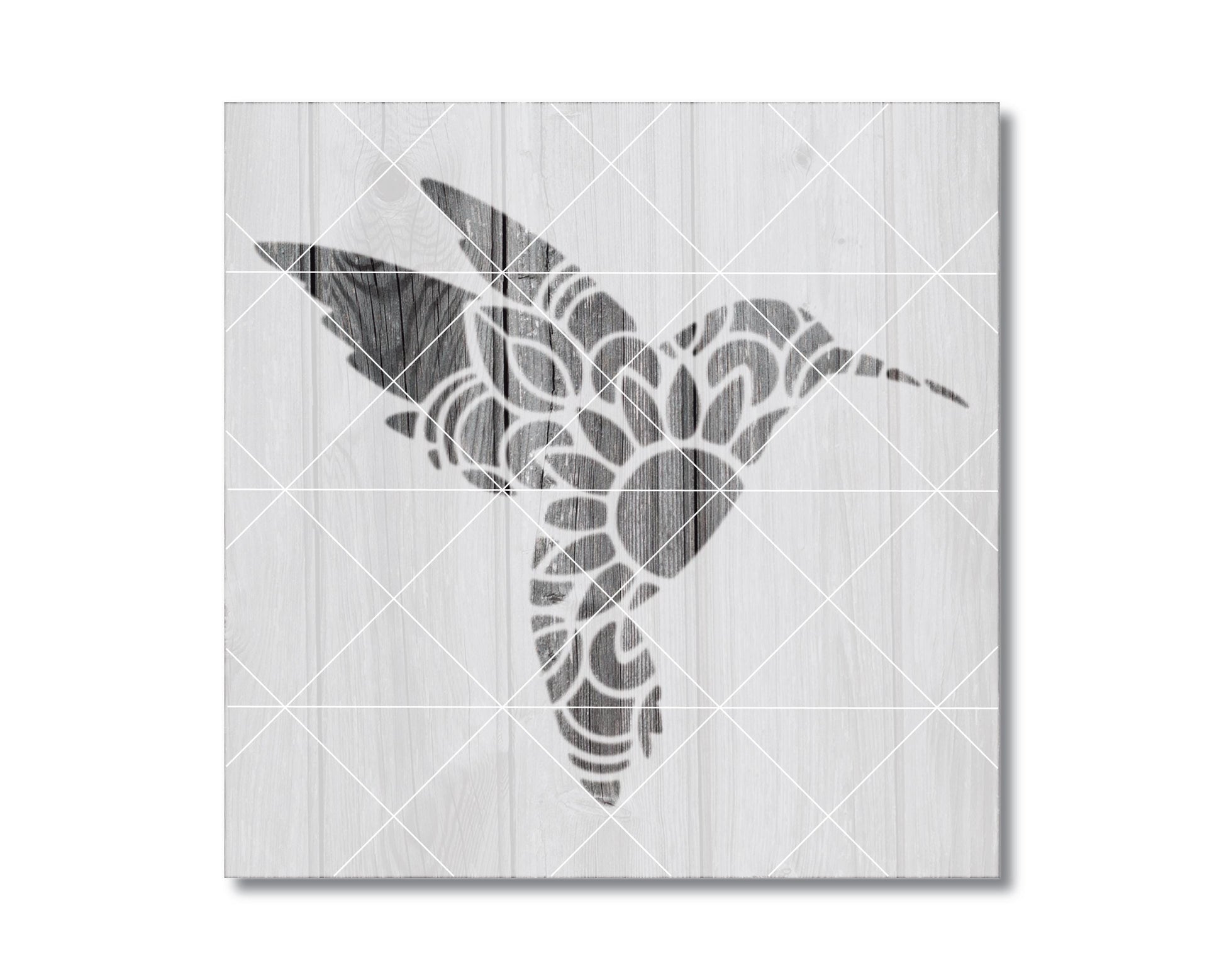A black and white image depicting a stylized hummingbird silhouette against a wooden background.