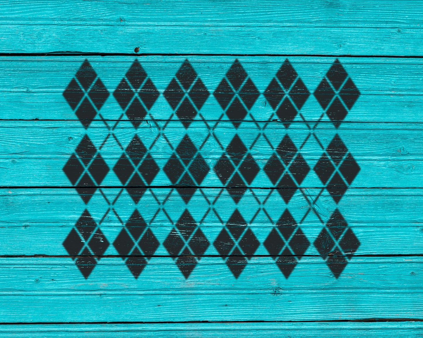 a pattern of black diamond shapes on a turquoise wooden surface.