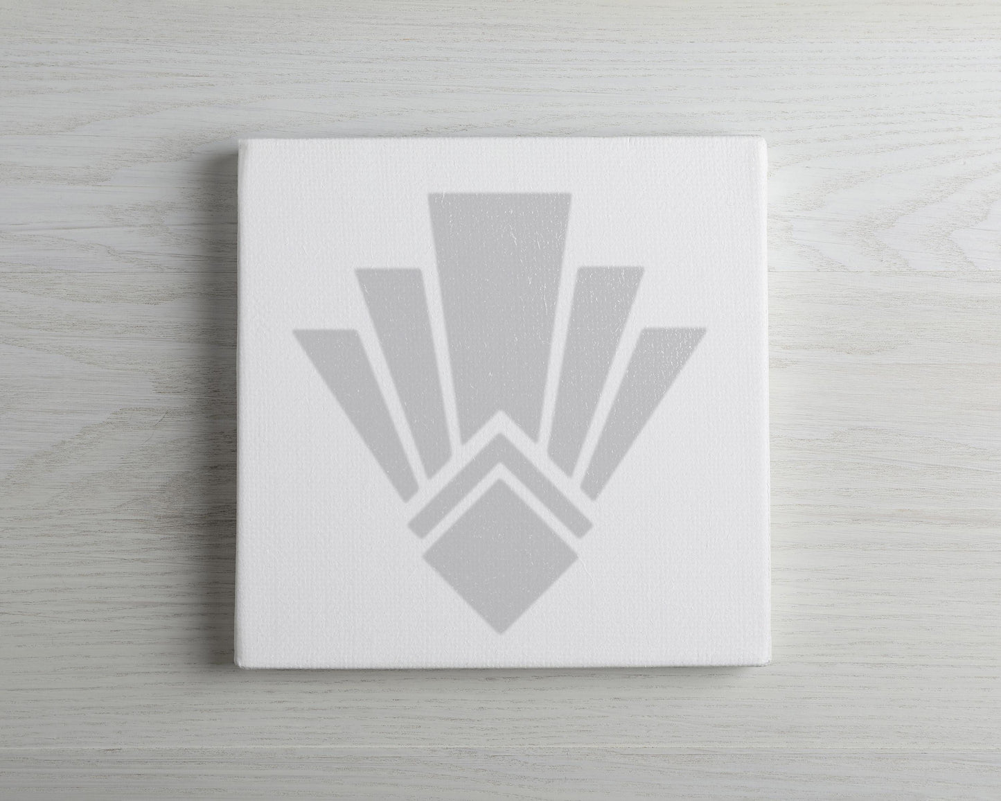 a white canvas with a stylized, abstract design in grey tones.