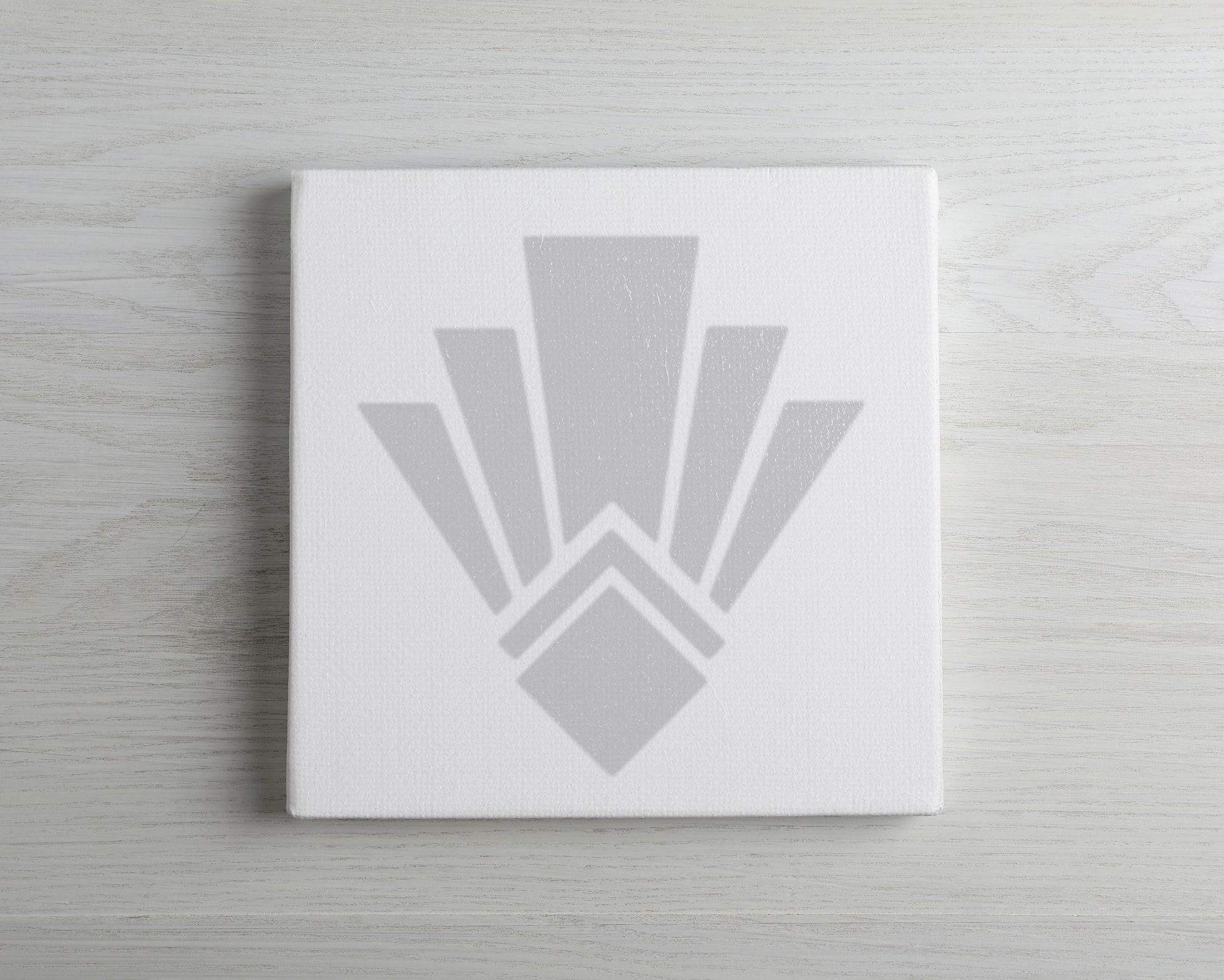 a white canvas with a stylized, abstract design in grey tones.