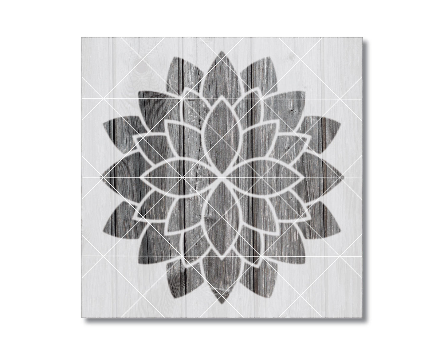 a wooden background with a black and white geometric pattern resembling a flower or mandala design.