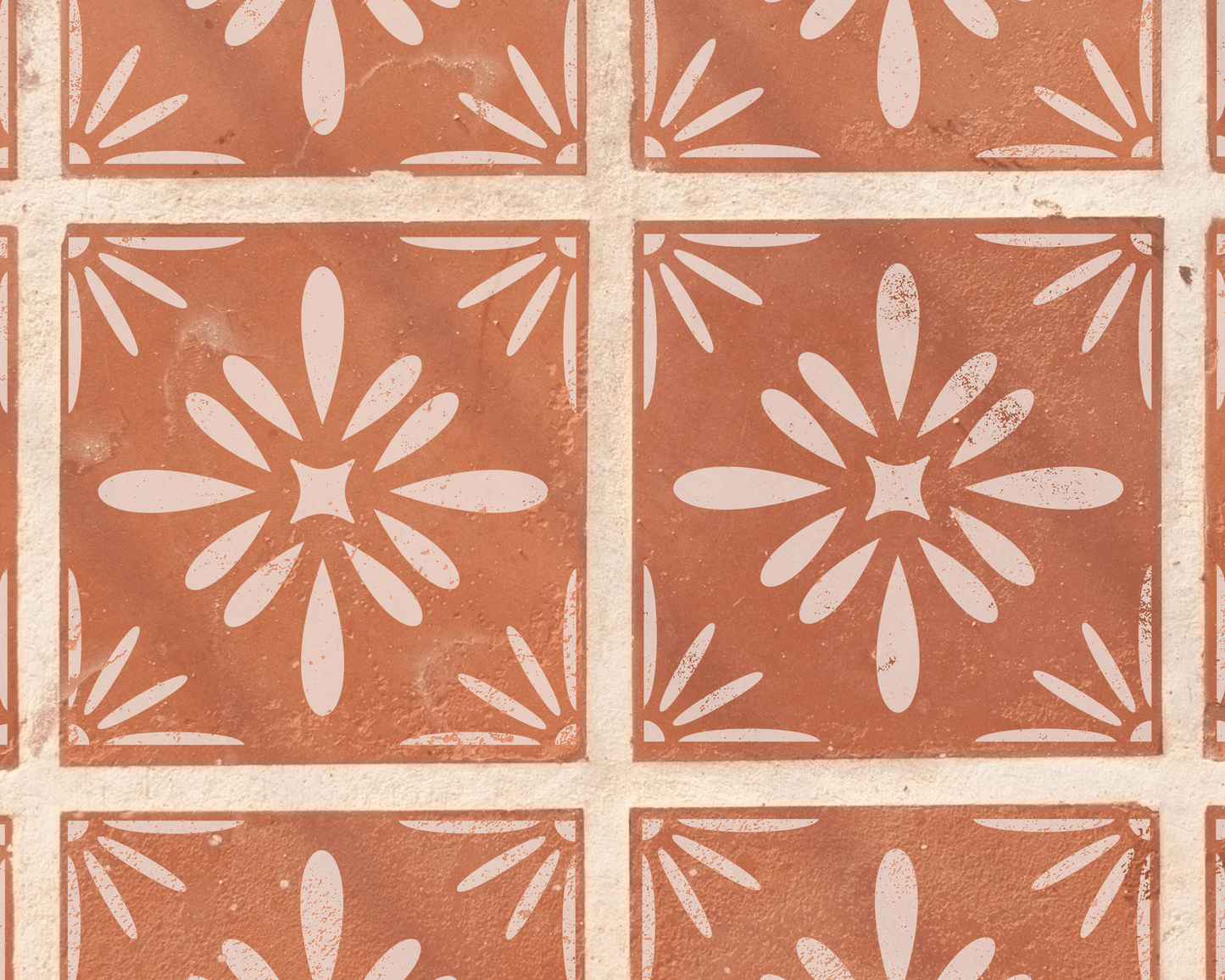 a pattern of red and white tiles arranged in a grid-like design, featuring a central flower-like motif.