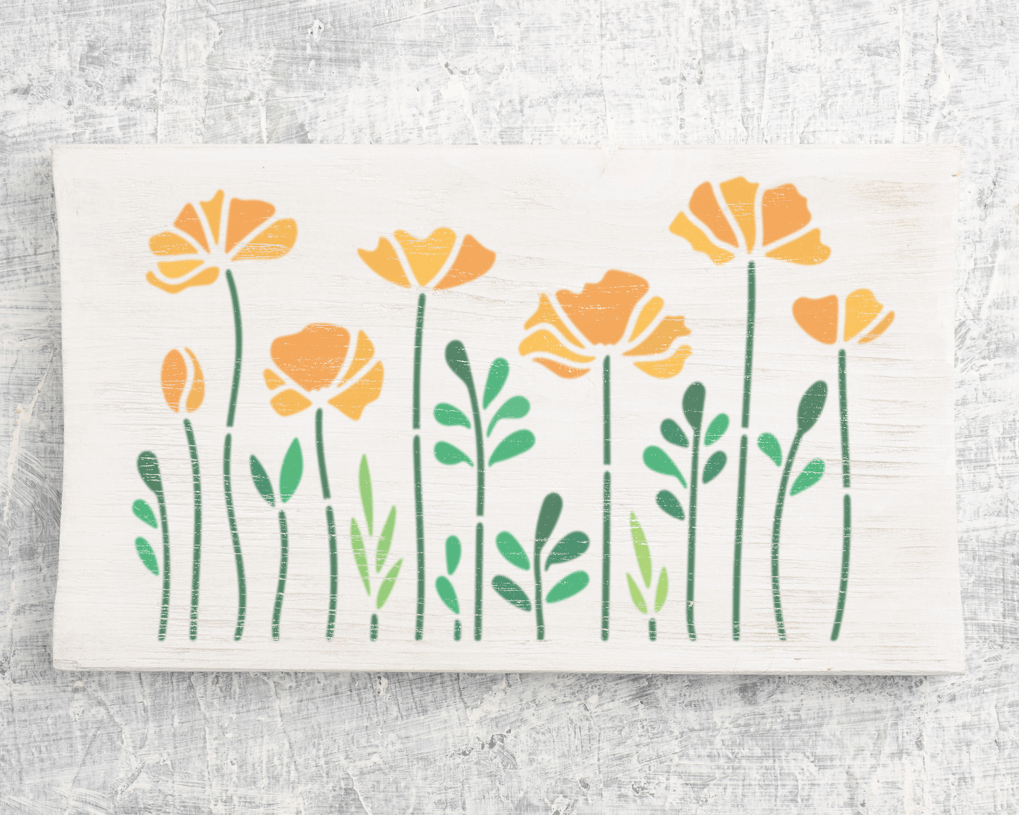 A white wooden surface with a design of yellow flowers and green leaves.