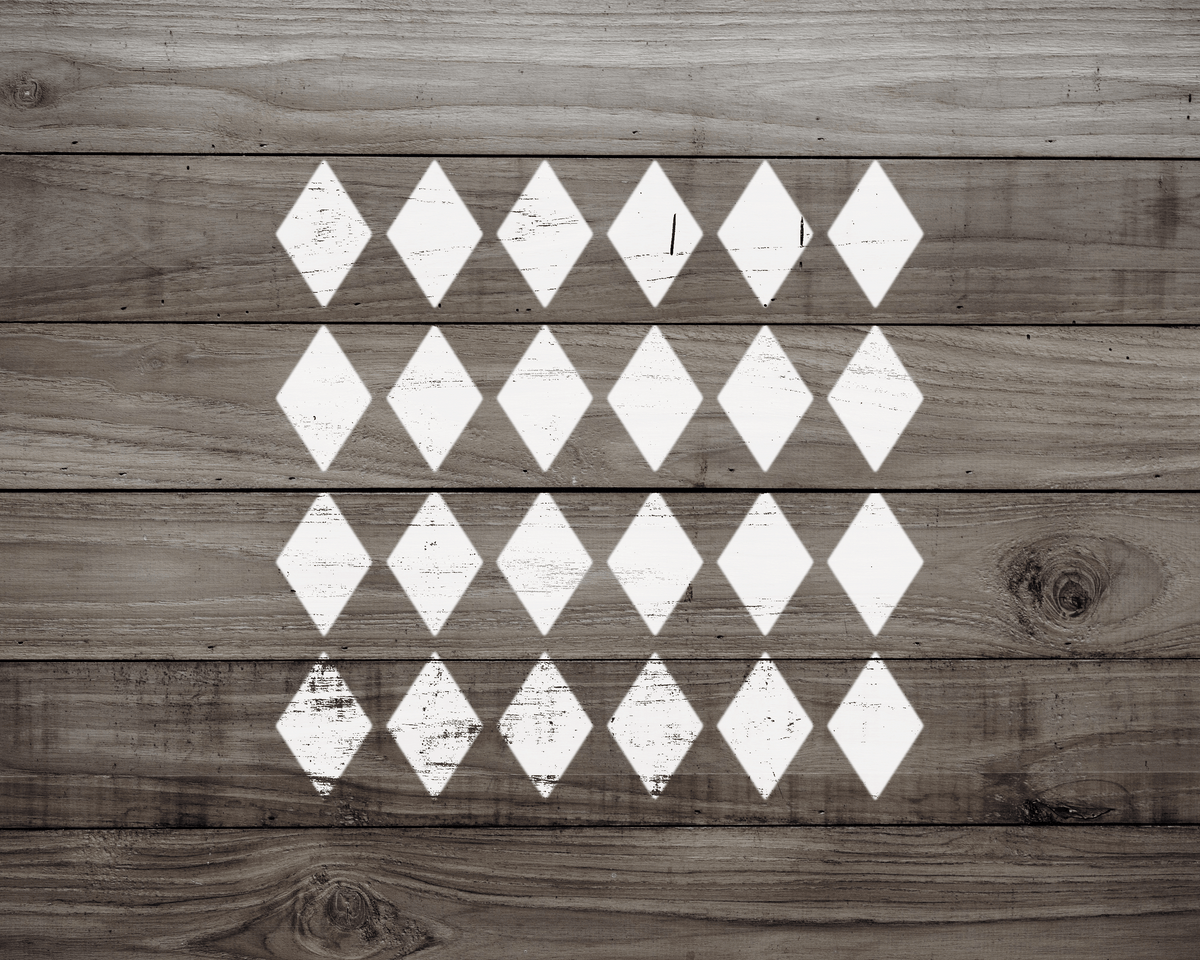 a wooden surface with a repeating pattern of white diamond shapes arranged in a grid-like fashion.