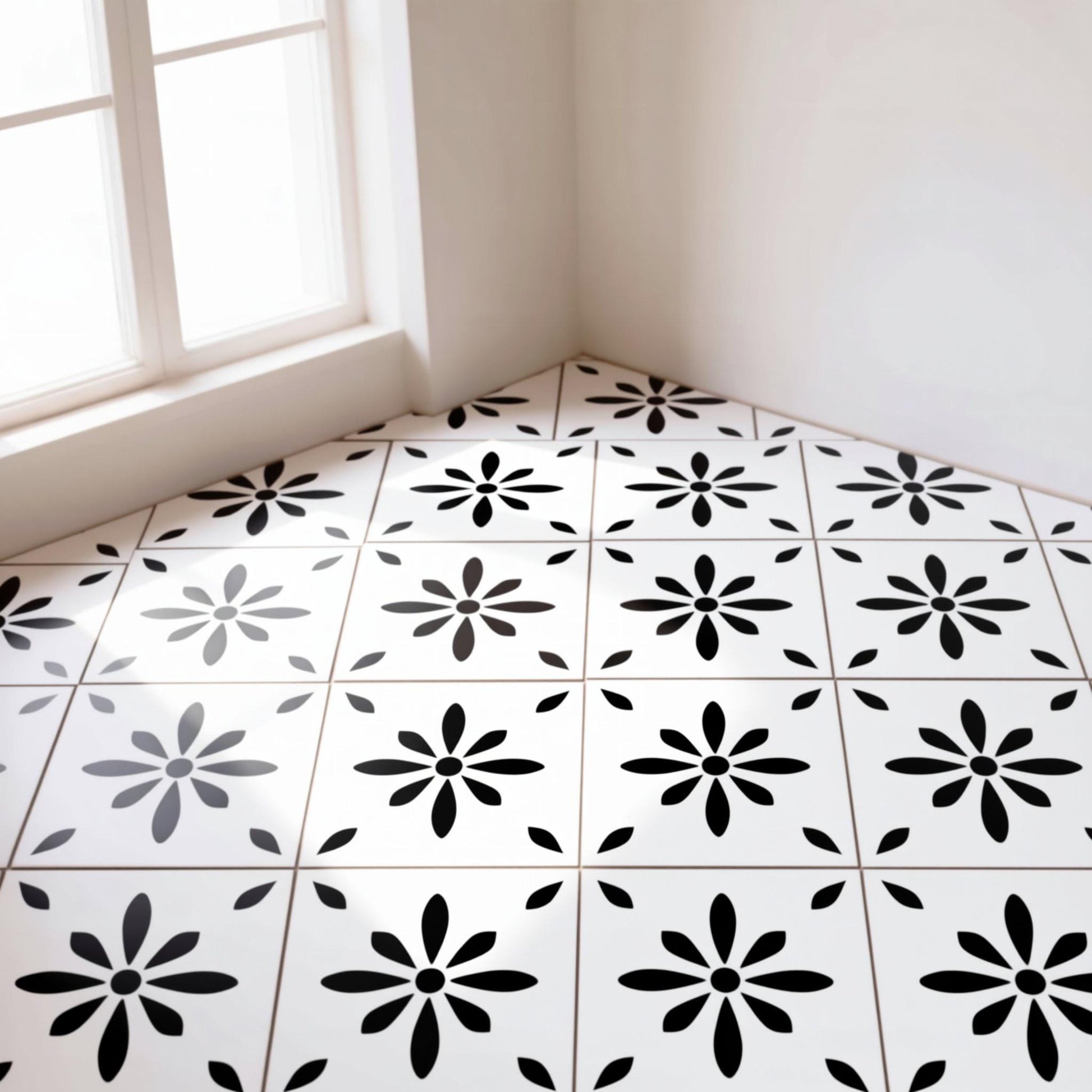 a white room with a black and white tile floor featuring a repeating pattern of black flowers. The room appears to be empty and well-lit, with a window on the left side.