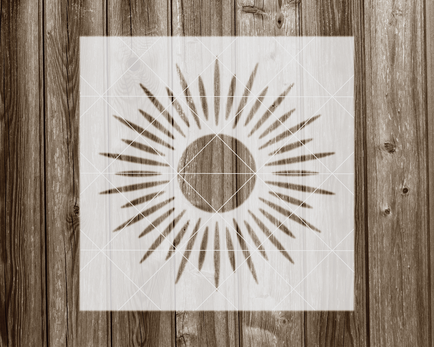 a wooden wall with a picture of a sun on it