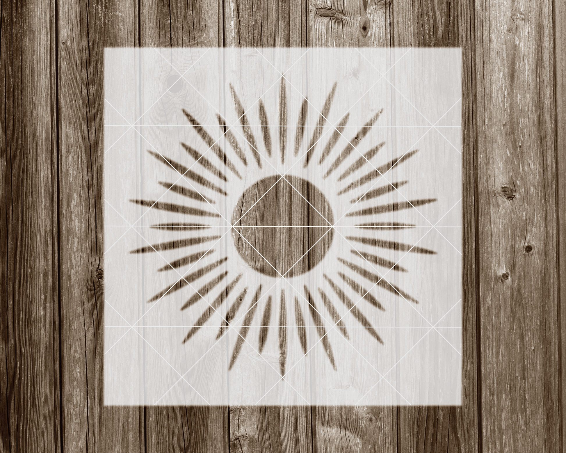 a wooden wall with a picture of a sun on it